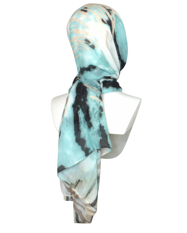 An elegant animal printed bamboo modal hijab in green turquoise and black, premium fabric 100% bamboo, breathable, moisture wicking, lightweight and non-slip.   great option for muslim women who want high end hijabs for work and daily outfits | Lina Zibdeh