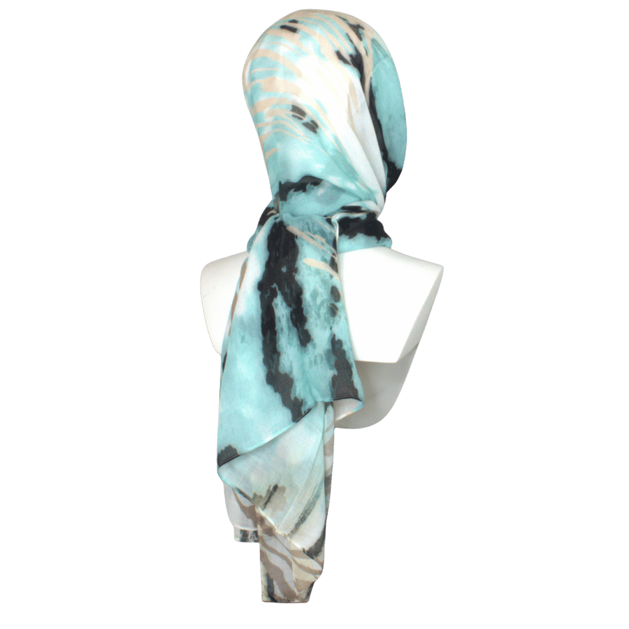 An elegant animal printed bamboo modal hijab in green turquoise and black, premium fabric 100% bamboo, breathable, moisture wicking, lightweight and non-slip.   great option for muslim women who want high end hijabs for work and daily outfits | Lina Zibdeh