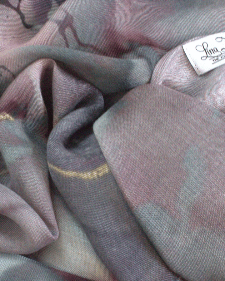 Close-up of a fabric with a brand label on a textured background