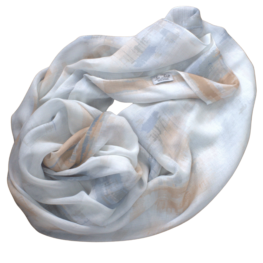 Flat lay of Coastal Mocha bamboo modal hijab showing soft airbrushed stripes in mocha beige, denim blue, and white | Lina Zibdeh