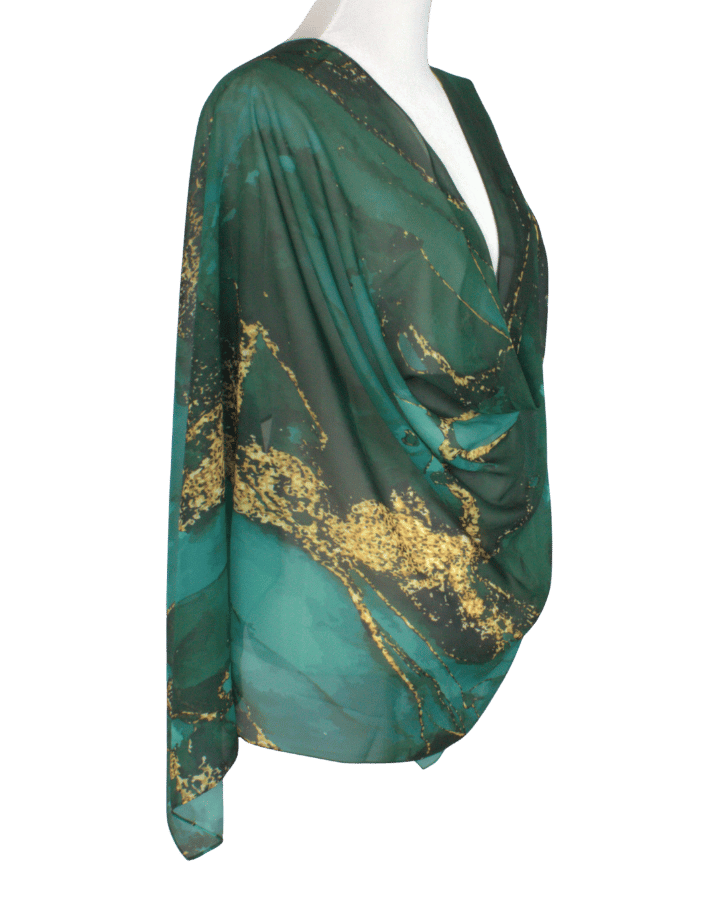 Elegant emerald chiffon hijab styled for Eid, weddings, and special celebrations