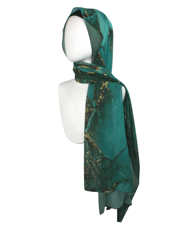 Emerald golden chiffon hijab wrapped in simple everyday style highlighting its versatile design