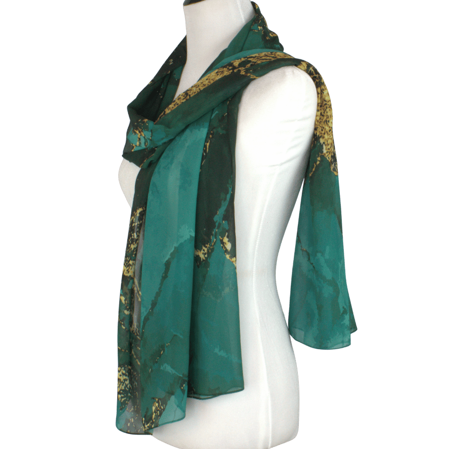 Lightweight emerald chiffon hijab styled with flowing drape for formal occasions