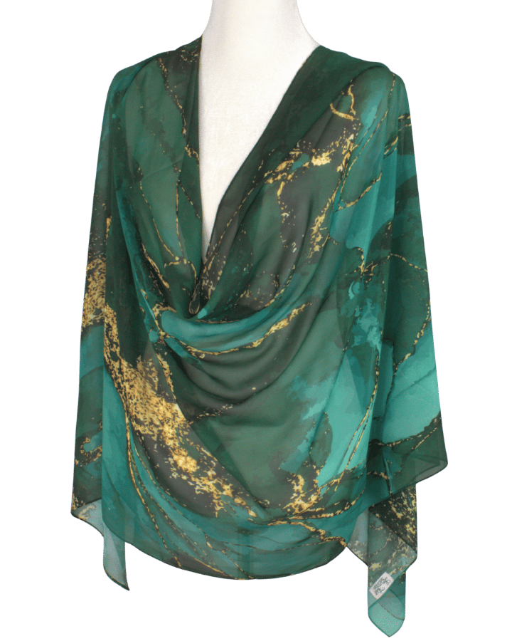 Fancy designer chiffon hijab in emerald green and gold displayed flat to show full luxurious print