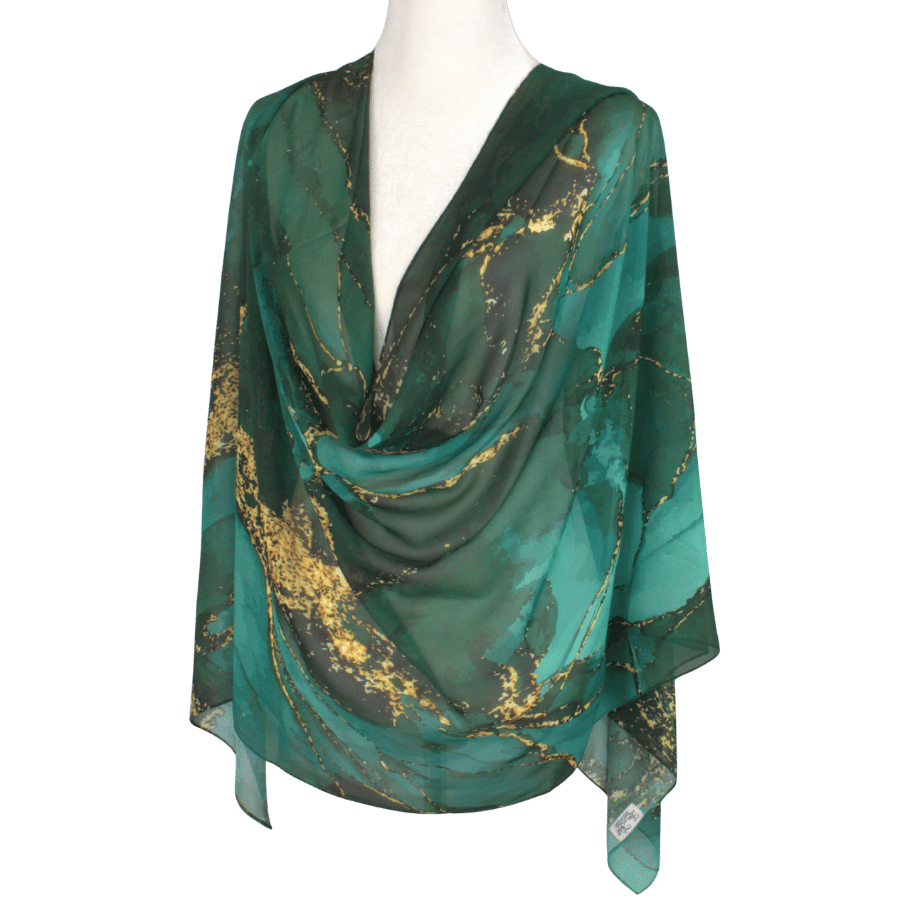 Fancy designer chiffon hijab in emerald green and gold displayed flat to show full luxurious print