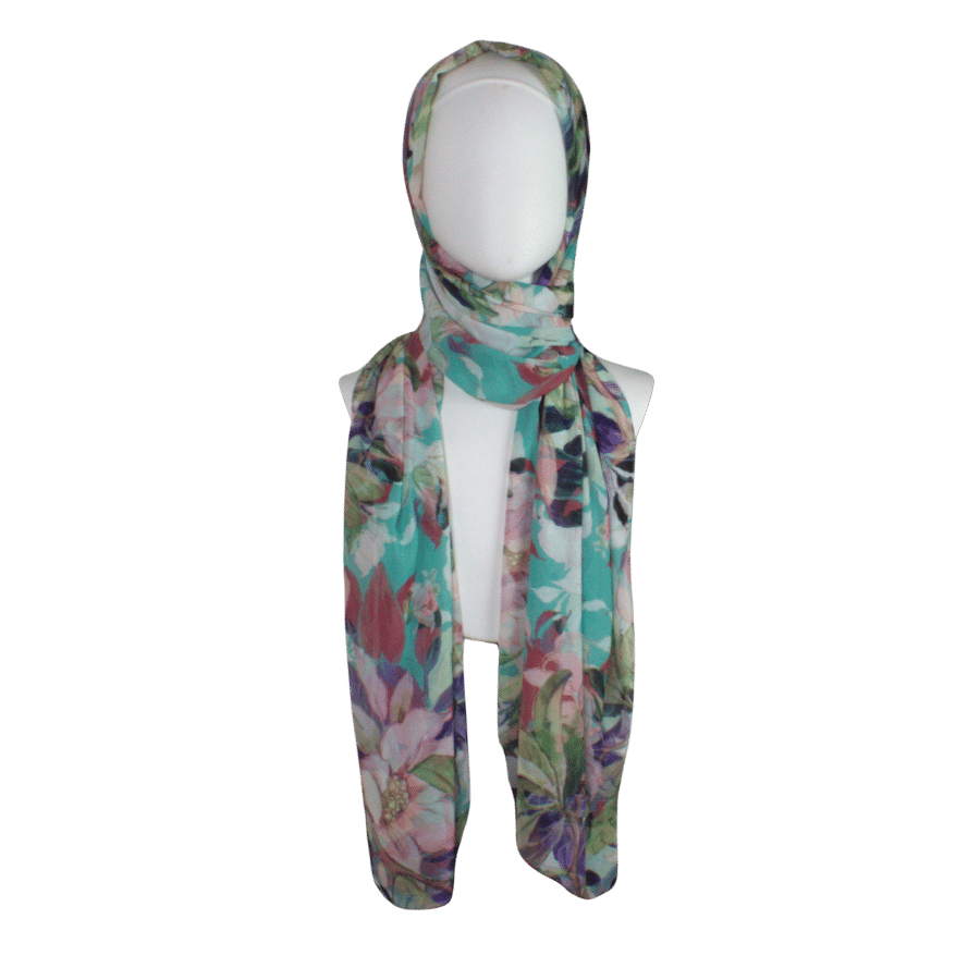 Premium foral hijab scarf for work and everyday. Colorful floral hijab scarf on a mannequin against a transparent background | Lina Zibdeh
