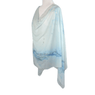 An elegant light blue designer print hijab headscarf for work and everyday. Ideal for summer and professional settings. Lina Zibdeh