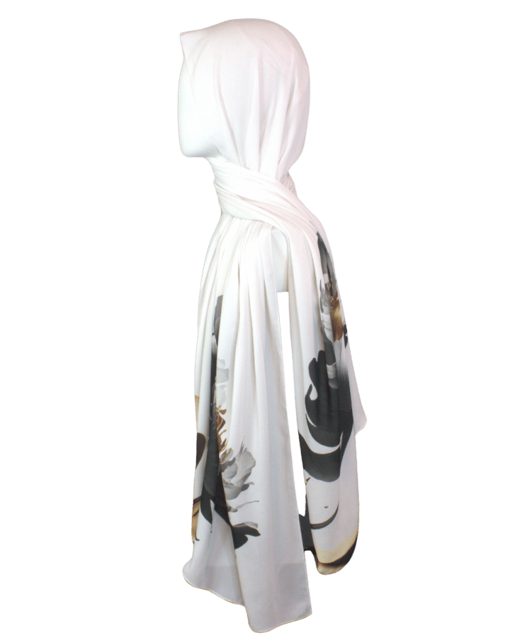 Elegant scarf with golden, black, and silver painted flowers on a soft white background.