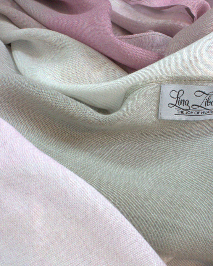 Close-up of soft bamboo modal hijab fabric with a visible brand label.