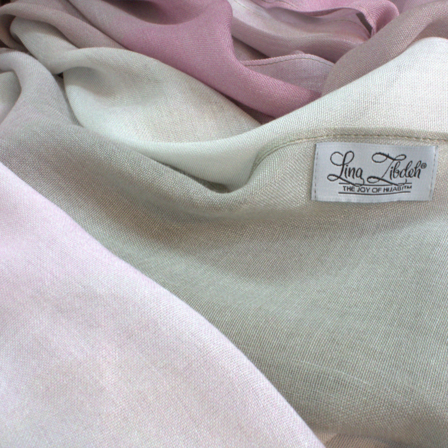 Close-up of soft bamboo modal hijab fabric with a visible brand label.