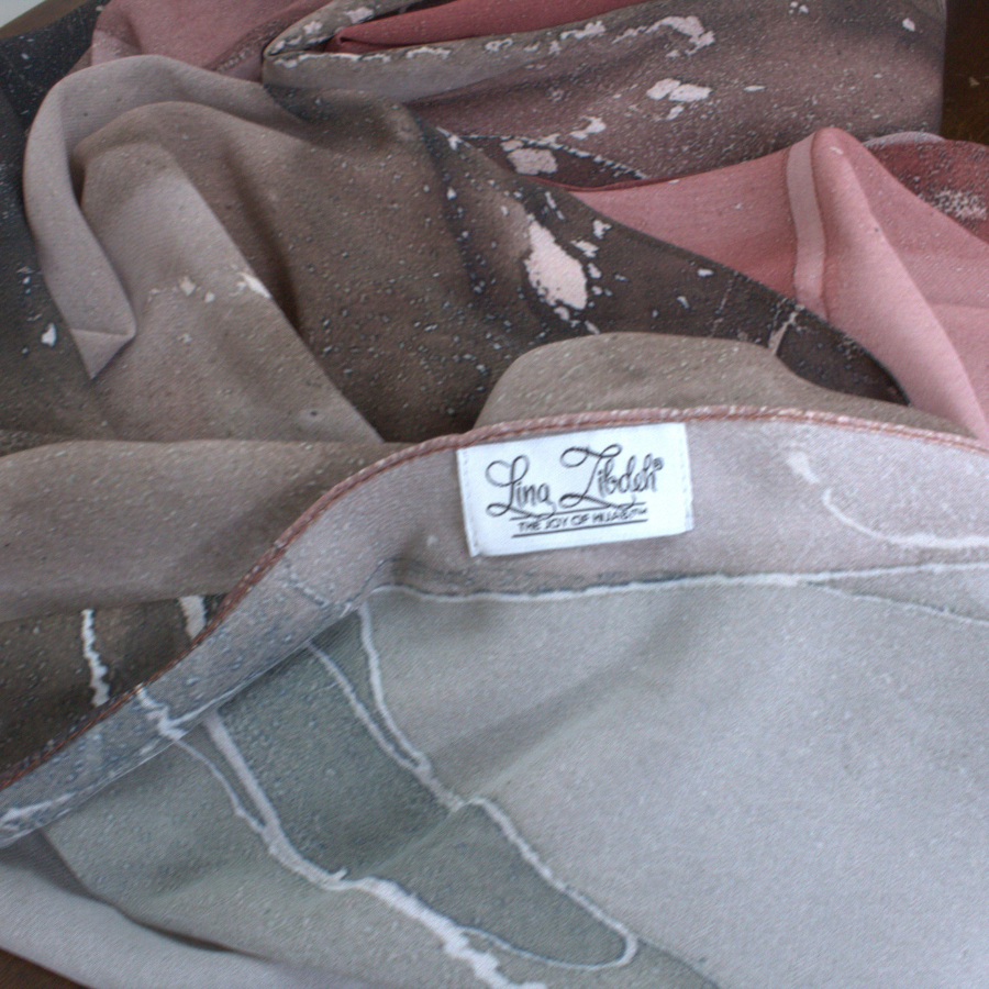 Close-up texture of Mocha and Spice soft luxury chiffon fabric with dual tone muted brown print