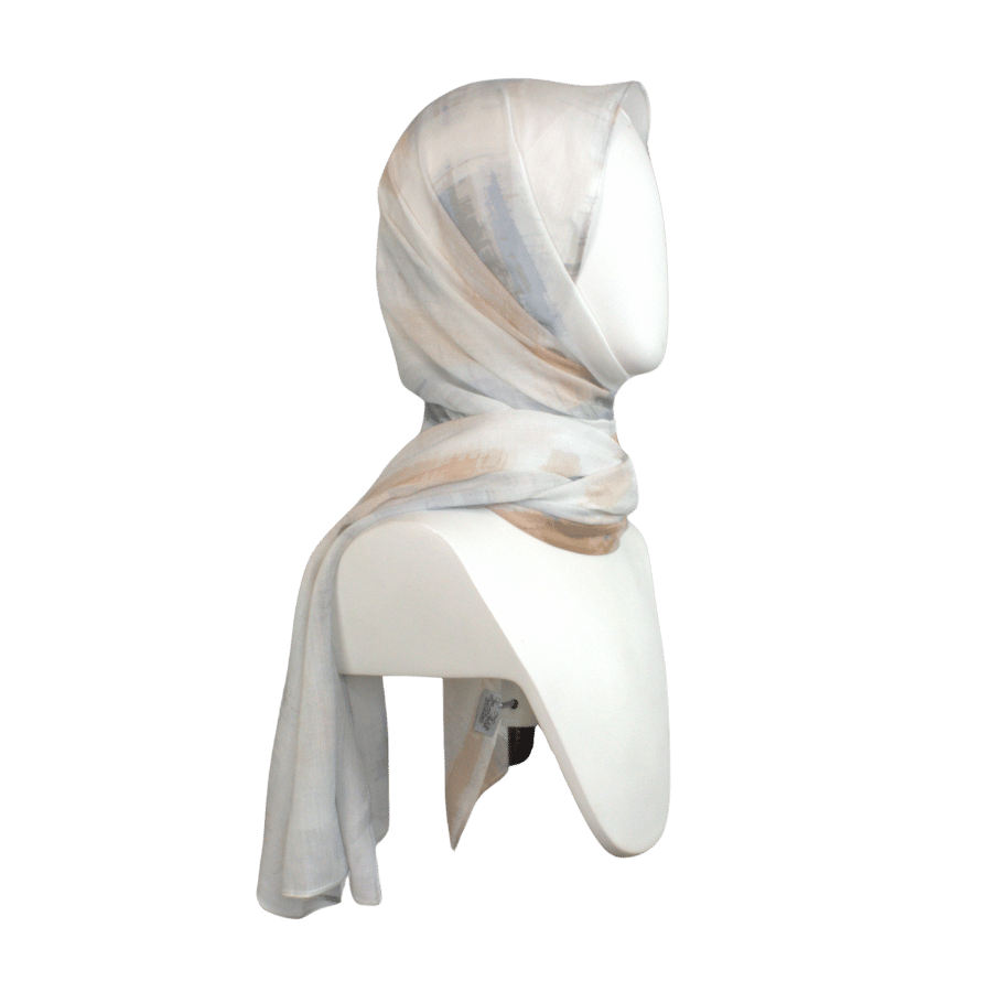 Lightweight bamboo modal hijab with airbrushed mocha and blue print laid on white background | Lina Zibdeh

