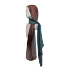 Luxurious Elaris Ombré printed bamboo hijab draped over shoulder, showing teal side | Lina Zibdeh