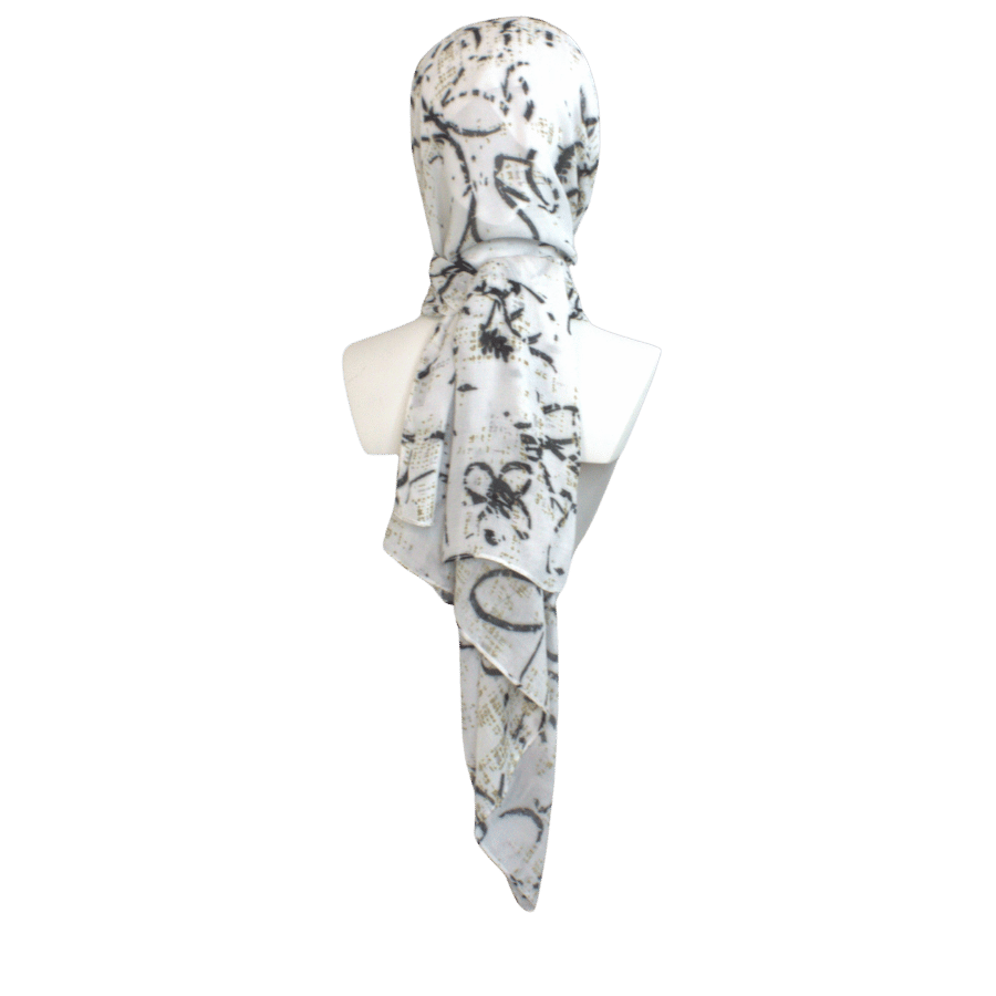 Printed bamboo modal hijab scarf, black floral print on a soft white background and bronze stripes. Ideal for work and hot weather | Lina Zibdeh