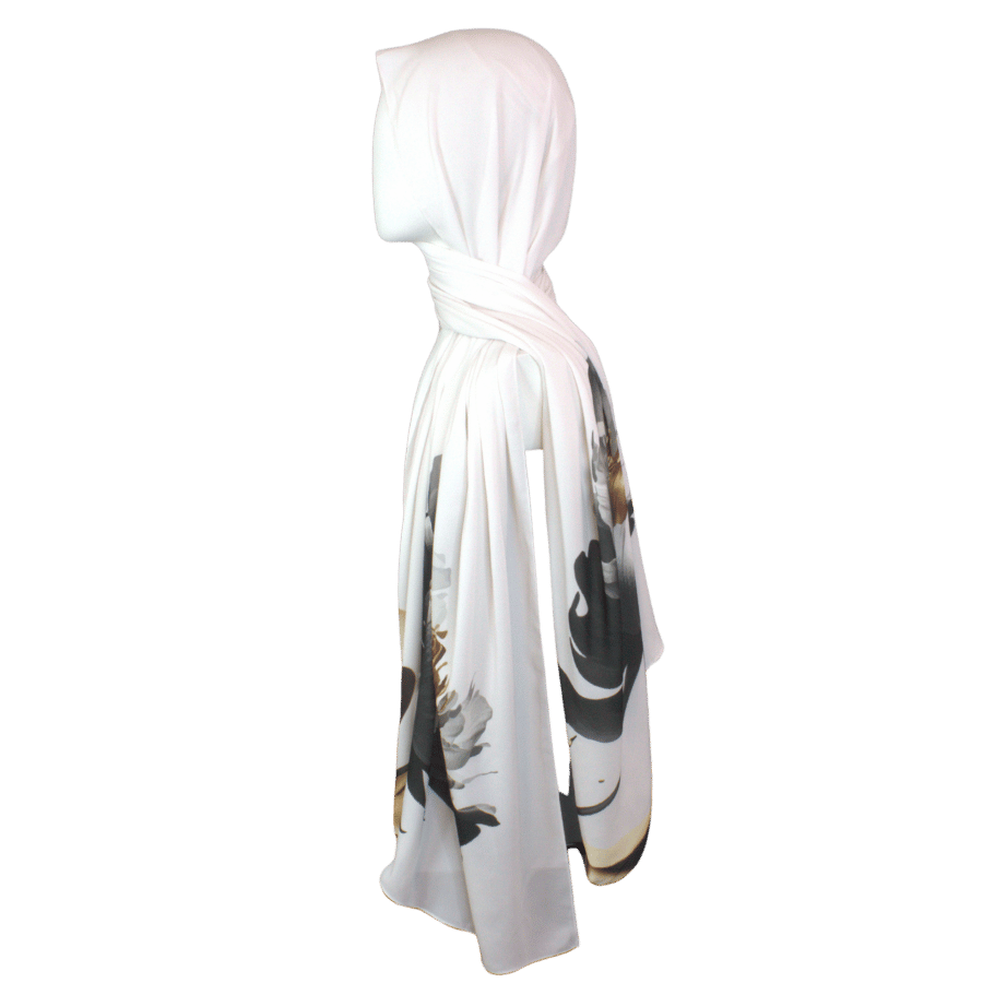 Elegant scarf with golden, black, and silver painted flowers on a soft white background.
