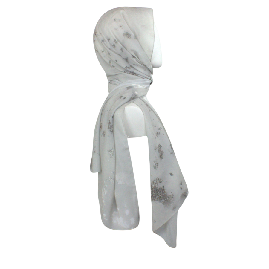 
Luxury silver hijab scarf chiffon with a perfect balance of matte and sheen to it, ideal for special occasions and work. A better grip, soft and easy to wrap. | Lina Zibdeh
